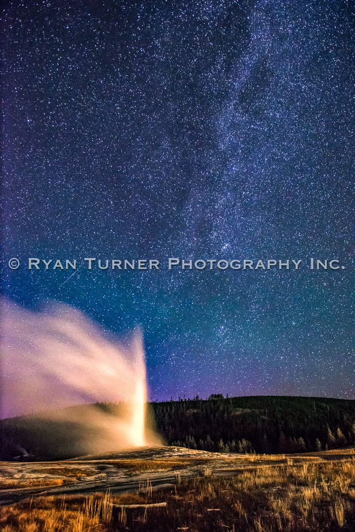 Glowing Old Faithful Under a Starry Night